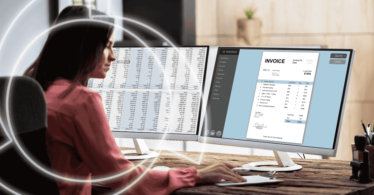 woman at computer managing spreadsheets
