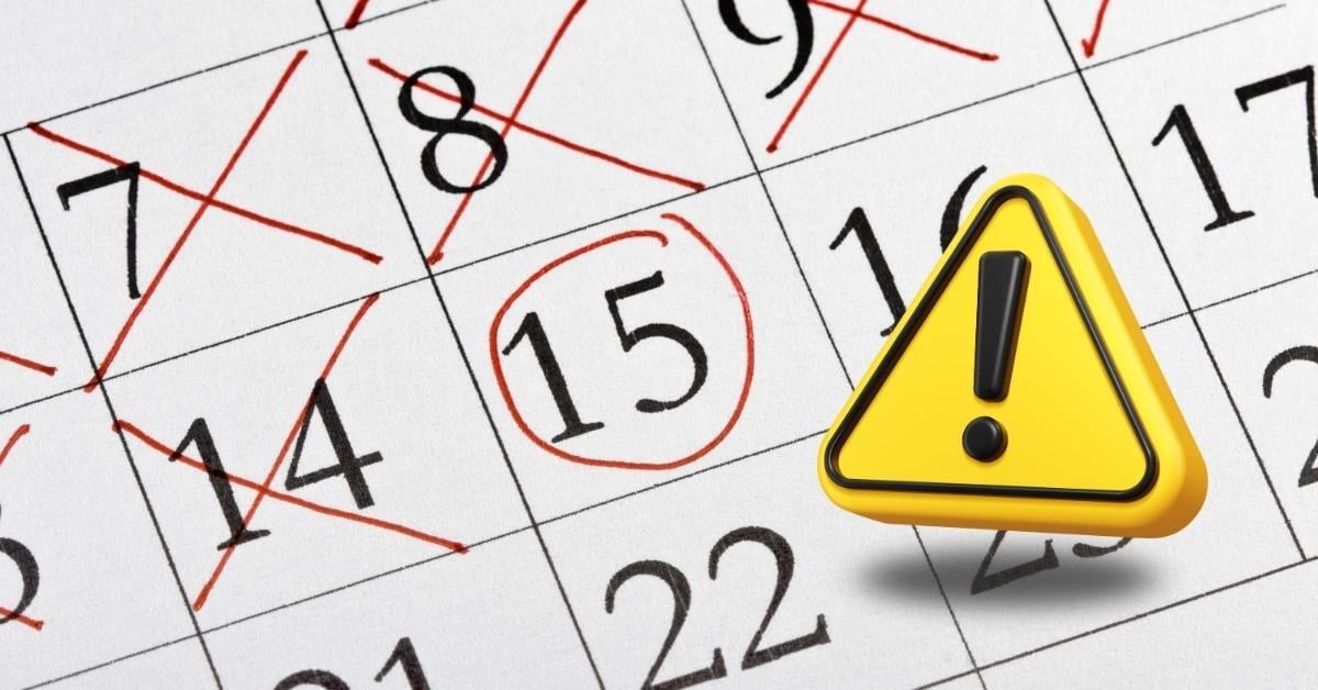 calendar with the 15th circled and yellow alert sign