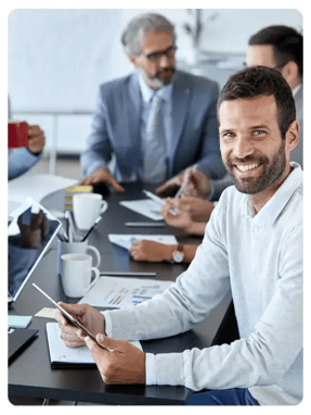 Conference Table with Casual Professional Male in Foreground