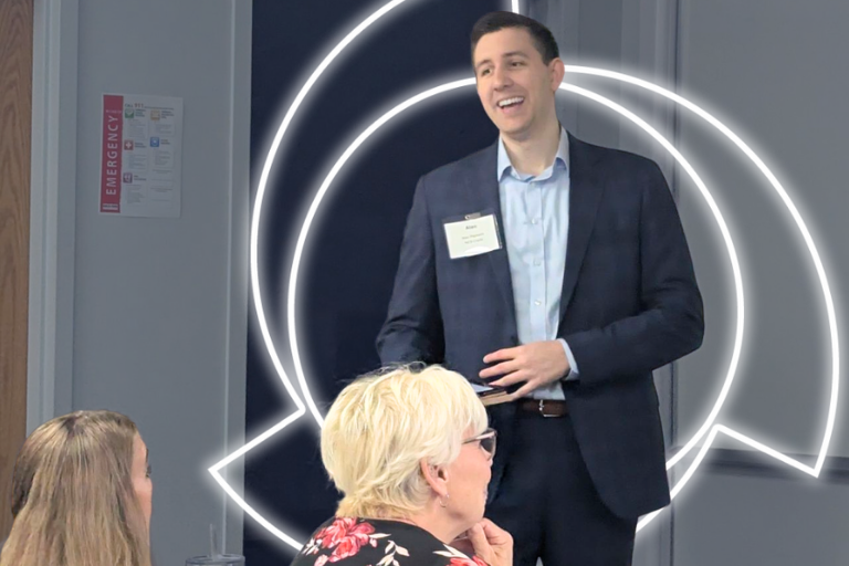 alec papesch smiling as he presents to credit group (1)