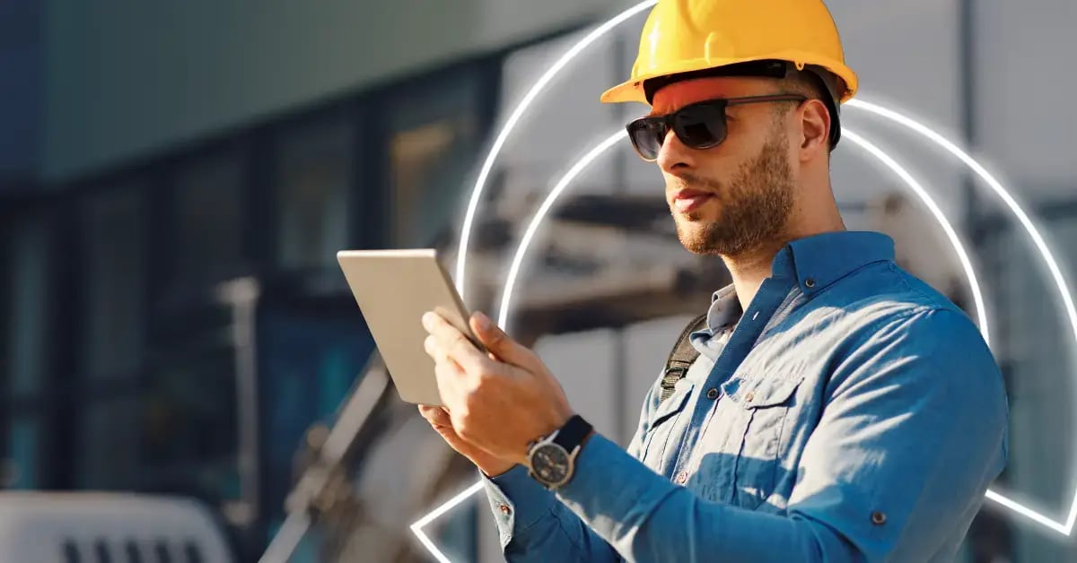 business man wearing sunglasses hardhat and holding clipboard on construction site