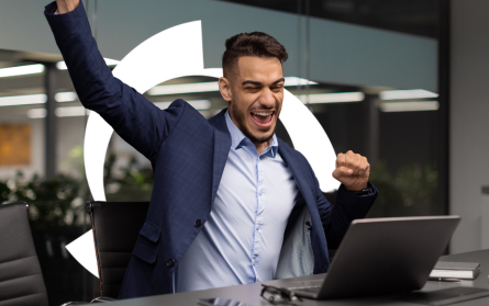 man-at-desk-with-happy-exclamation-and-credit-halo-1