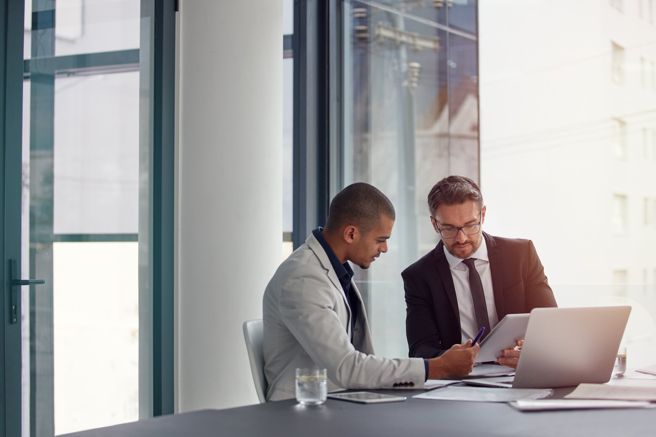 two businessmen having an office meeting